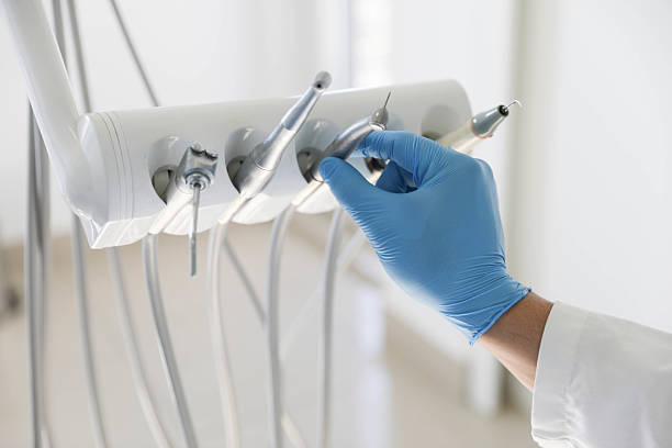 Professional Tooth Extraction technician working in Burlington, ND